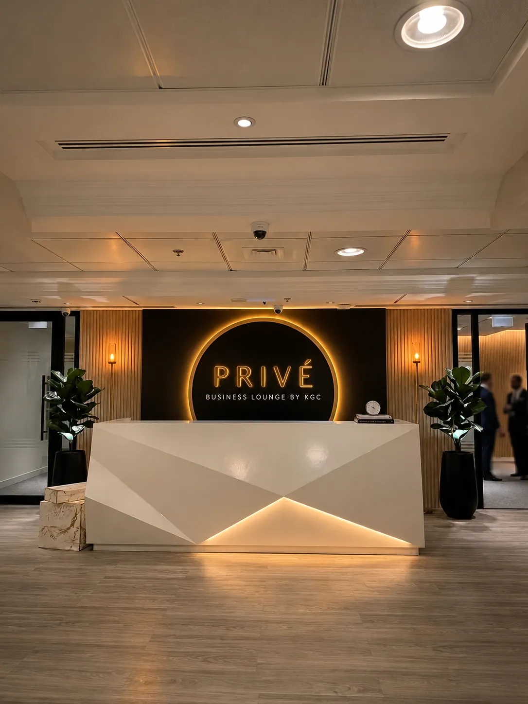 The Privé Lounge reception with illuminated wordmark
